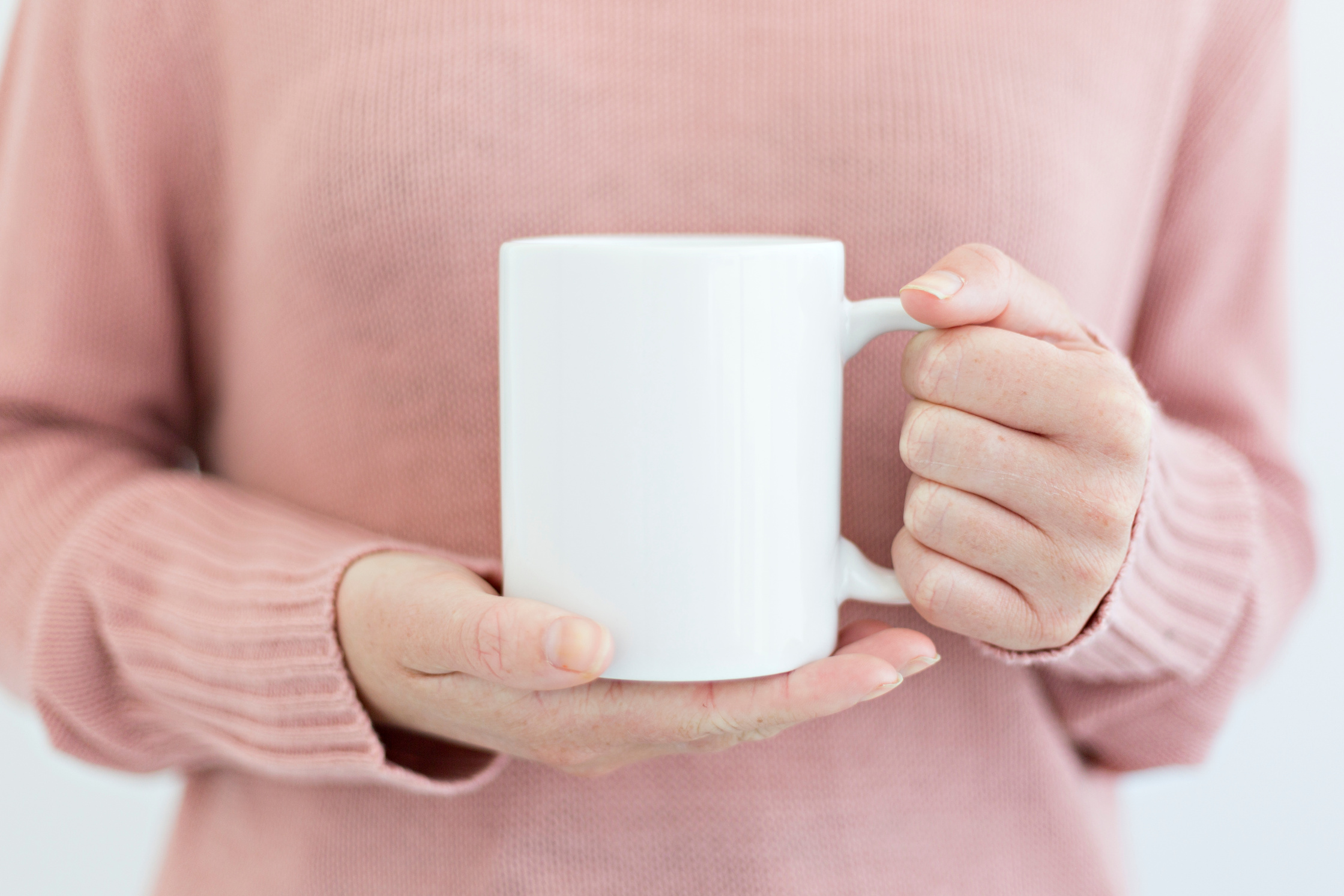 Person Holding a Coffee Mug 